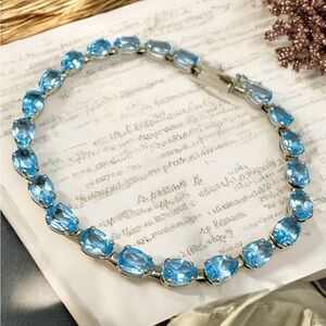 14kt Yellow Gold tennis teardrop Blue Topaz Bracelet